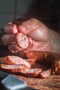 Sliced Ã¢â¬â¹Ã¢â¬â¹smoked calabrese sausage in a wooden table,copy space